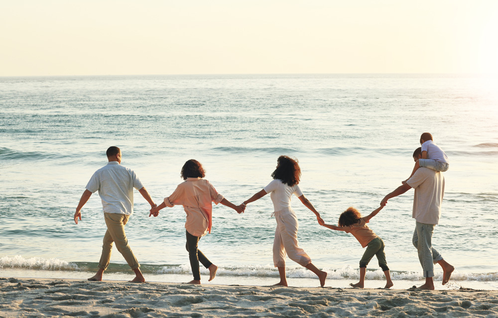 Web-big-family-walking-and-holding-hands-at-beach-at-2023-03-09-09-05-43-utc