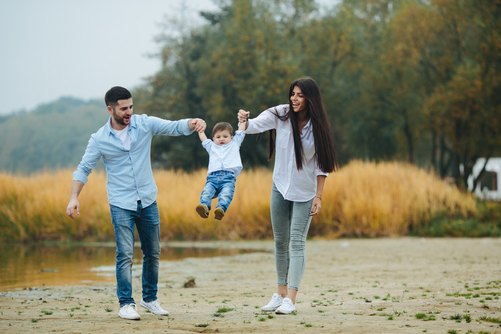 Web-young-family-walking-at-the-beach-2021-08-26-17-17-44-utc